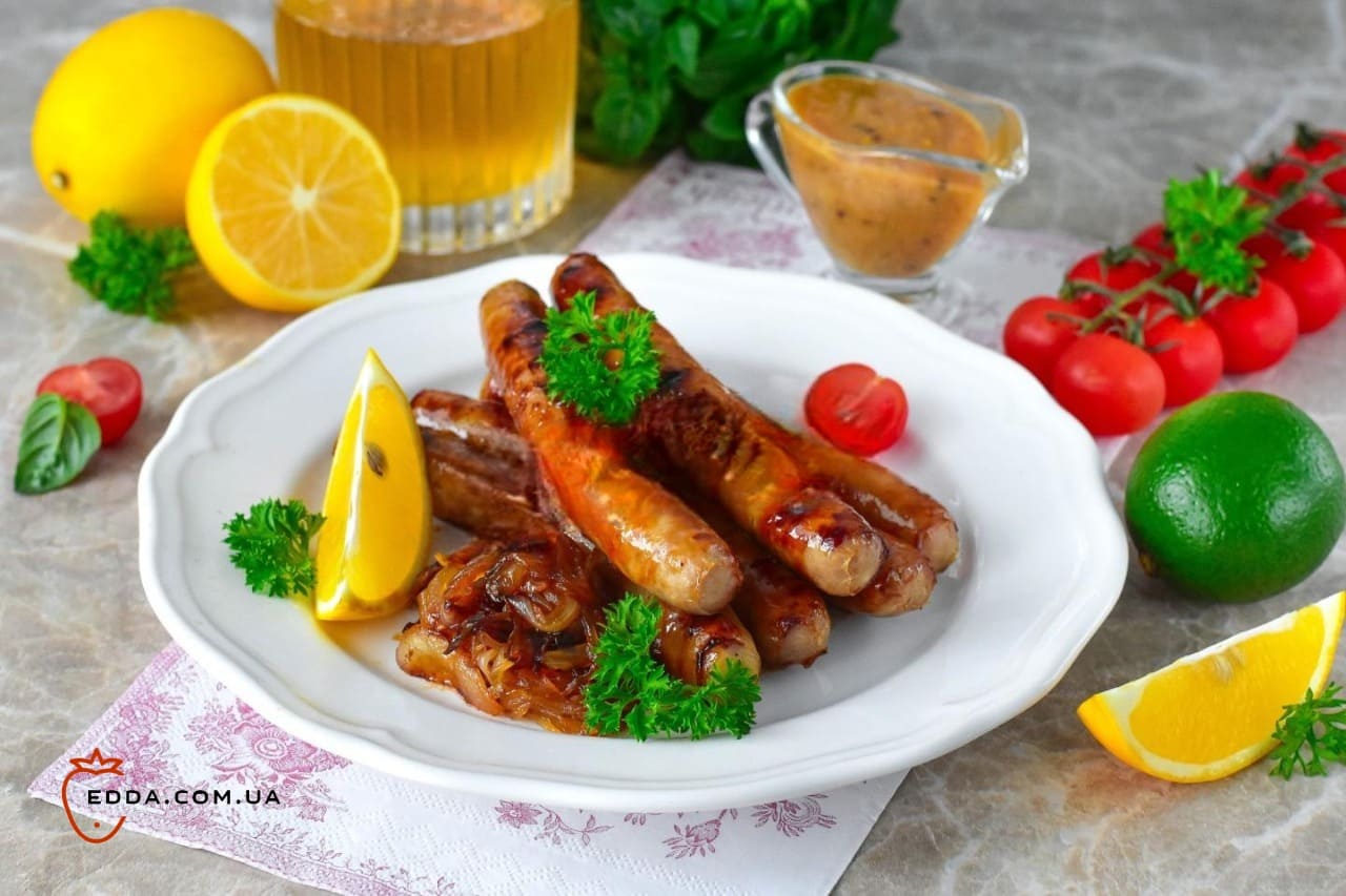 Ковбаски на грилі